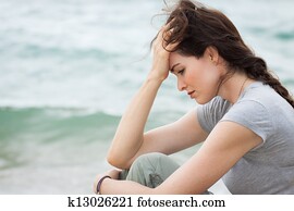 Sad and upset woman deep in thought