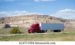 Semi-truck on the road in the desert Semi-truck on the road in the desert