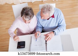 Senior Couple Calculating Budget