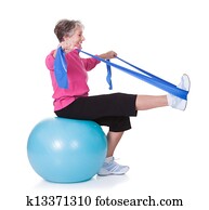 Senior Woman Stretching Exercising Equipment