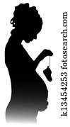 silhouette of a pregnant girl with shoes silhouette of a pregnant girl with shoes