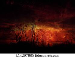 Stark tree silhouette against night sky Elements of this image furnished by NASA