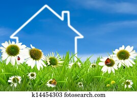 Symbol of a house on green sunny field Symbol of a house on green sunny field