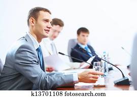 Three businesspeople at meeting