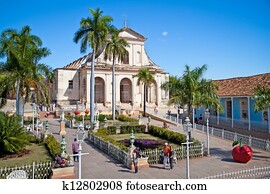 Tourists admire typical architecture  in Trinidad, Cuba. 