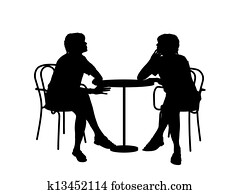 two women sitting at the table