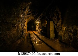 Underground mine passage with rails