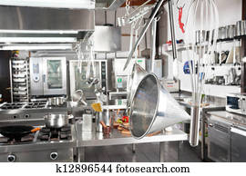 Utensils Hanging In Commercial Kitchen
