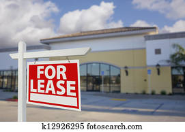 Vacant Retail Building with For Lease Real Estate Sign Vacant Retail Building with For Lease Real Estate Sign