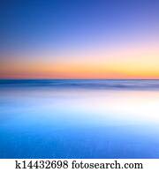 White beach and blue ocean on twilight sunset