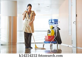 Woman cleaning building hall Woman cleaning building hall