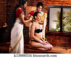 Woman having ayurveda spa treatment.