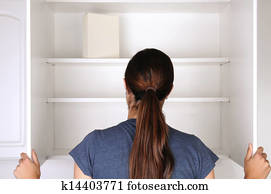 Woman Looking in Empty Pantry