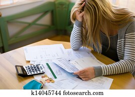 woman with debts and bills