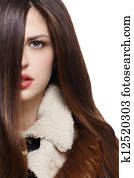 Woman with long brown hairs