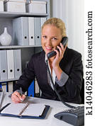 woman with phone in office