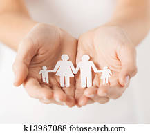 womans hands with paper man family womans hands with paper man family