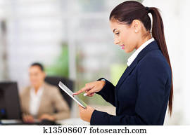 young businesswoman using tablet computer