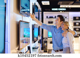 Young couple in consumer electronics store