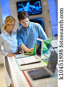 Young couple in consumer electronics store
