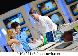 Young couple in consumer electronics store