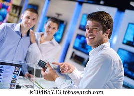 Young couple in consumer electronics store