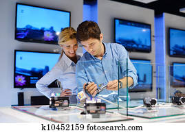 Young couple in consumer electronics store