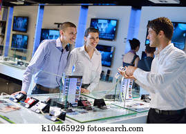 Young couple in consumer electronics store