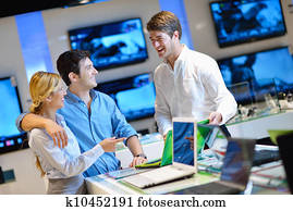 Young couple in consumer electronics store