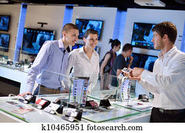 Young couple in consumer electronics store