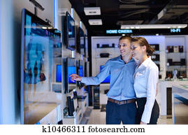 Young couple in consumer electronics store