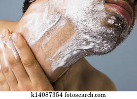 Young man shaving Young man shaving