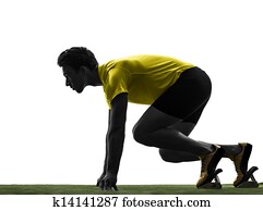 young man sprinter runner in starting blocks silhouette