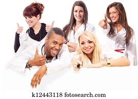 Young medical students smiling making positive thumb gesture