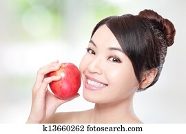 young woman eating red apple with health teeth young woman eating red apple with health teeth