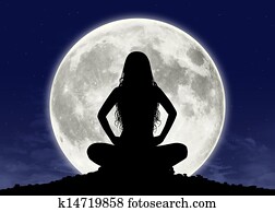 young woman in meditation at the full moon young woman in meditation at the full moon