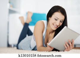 Young woman with touch screen tablet computer