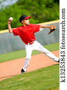 Youth ball player throwing ball