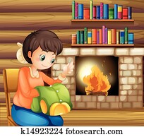 A woman sewing near the fireplace A woman sewing near the fireplace