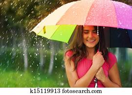 Beautiful woman under rainbow umbrella Beautiful woman under rainbow umbrella
