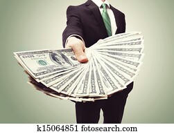 Business Man Displaying a Spread of Cash Business Man Displaying a Spread of Cash