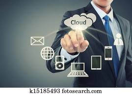 Business man pointing at cloud computing