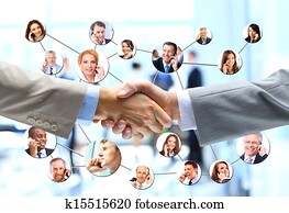 business people handshake with company team in background
