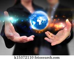 Business people holding business world Business people holding business world