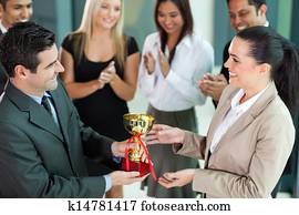 business team winning a trophy business team winning a trophy