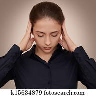 Business woman thinking hard with concentration holding hands head on dark background