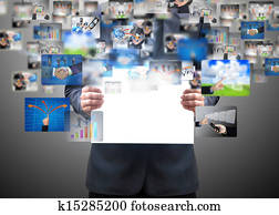Businessman holding a business card Businessman holding a business card