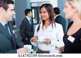 businesspeople interacting during conference coffee break