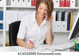 Businesswoman calling by phone