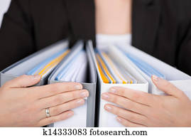 Businesswoman With Ring Binders